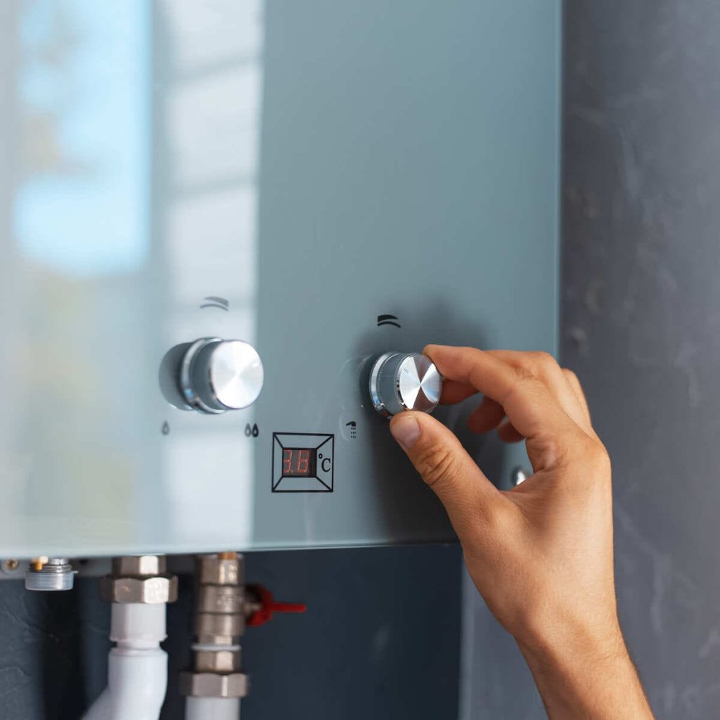 Adjusting temperature of a tankless water heater