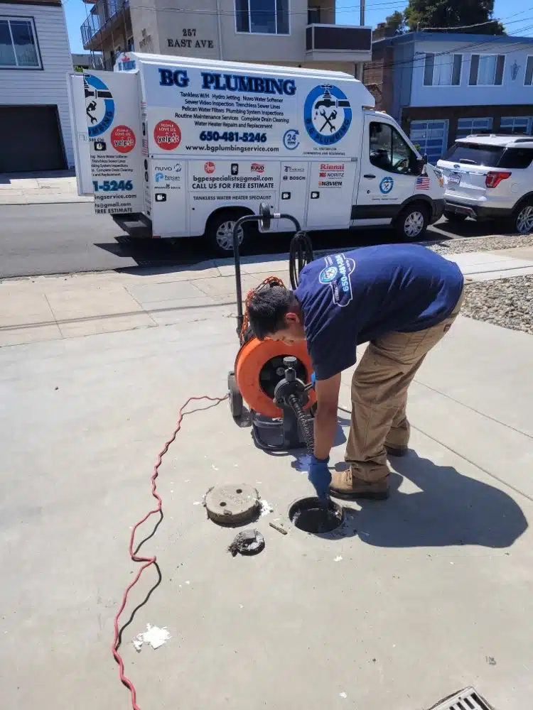 Professional plumber delivering a sewer jetting service
